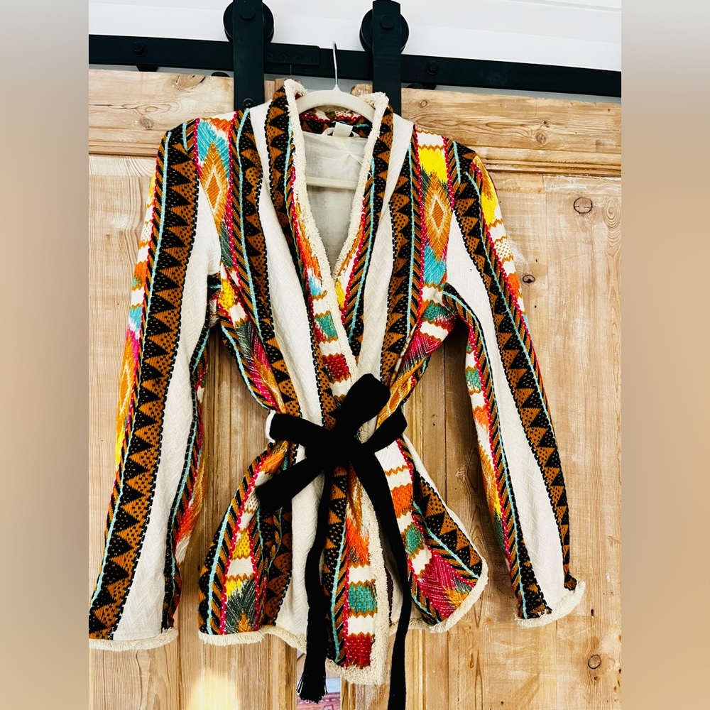 Fabulous tribal-inspired fully-lined jacket with tie-belt and front pockets